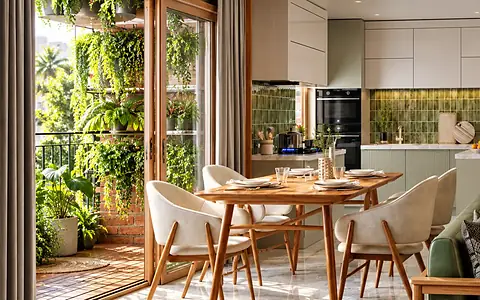 Dining opening onto a planted balcony